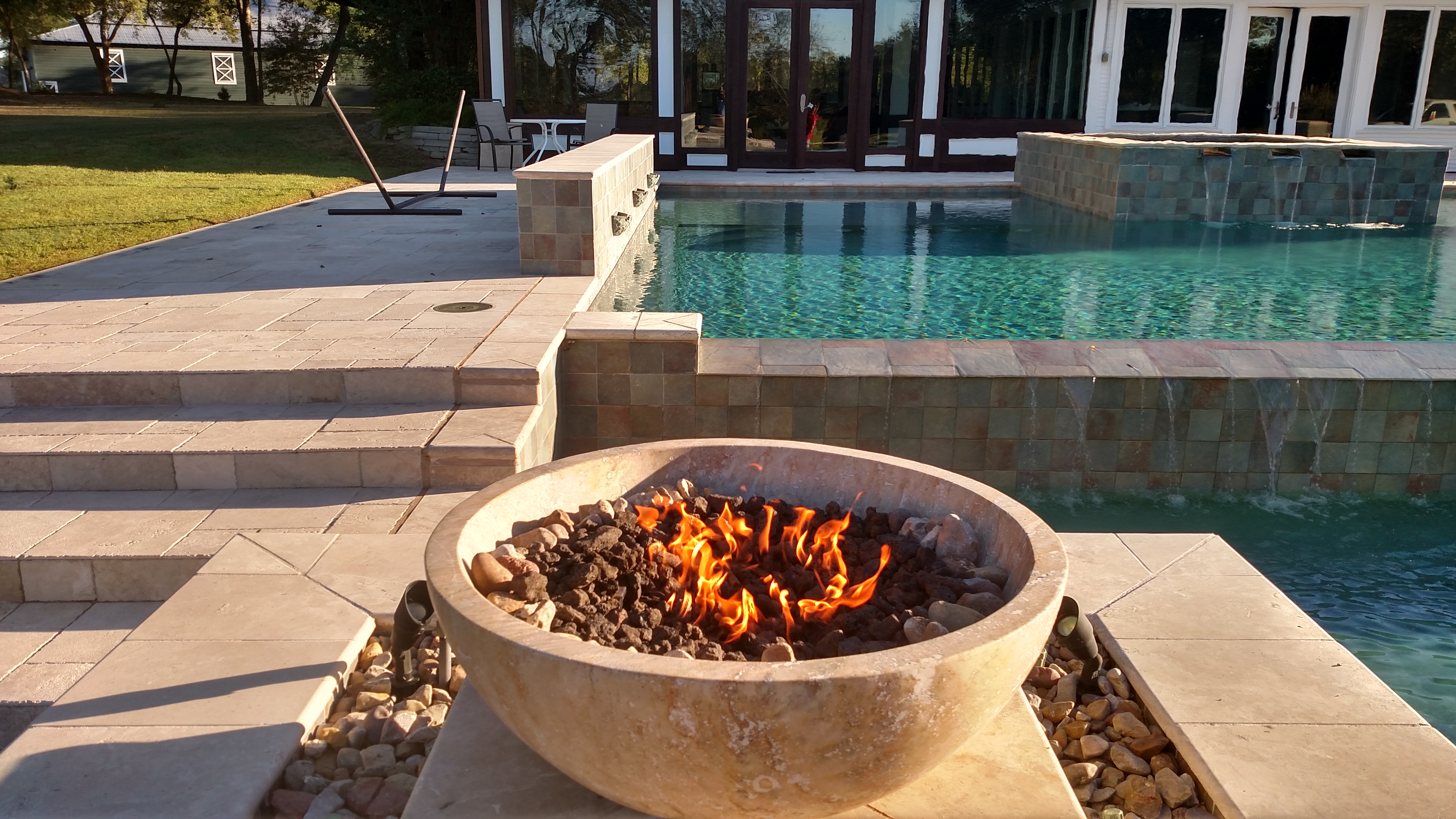 fire bowl next to pool